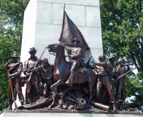 A close-up of the soldiers at the base of the statue of General Lee.